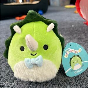 NWT Squishmallow green and white dinosaur whose name is Tristan